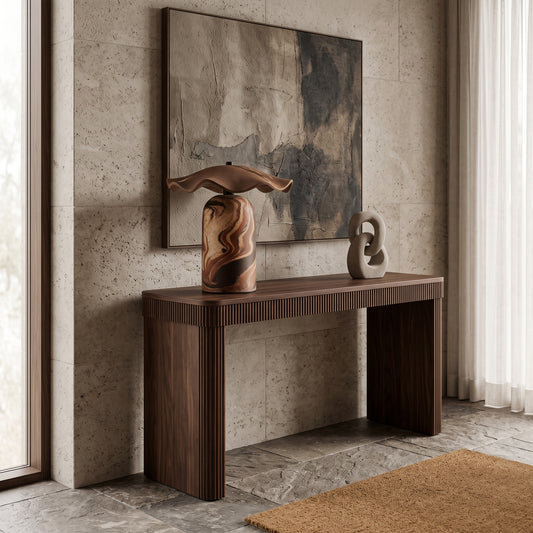 Artisanal ceramic accent lamp styled on an entryway wooden console table with contemporary wall art